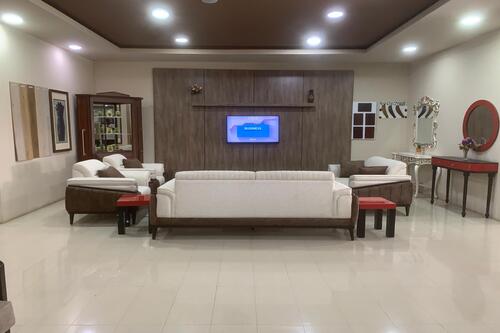 A stylish living room with a green sofa